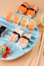 rolls and sushi on a plate in the form of fish Royalty Free Stock Photo