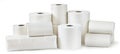 Rolls of toilet paper, paper towels and packs of napkins isolated on white Royalty Free Stock Photo