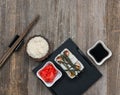 Rolls on tray and a bowl of rice top view Royalty Free Stock Photo