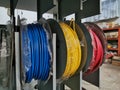 Rolls of used insulated wires in factory.