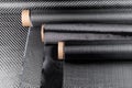 Rolls with various real woven carbon fiber enforcement raw material cloth. composite material industry high tech background