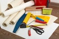 Rolls of wallpapers and various tools for wallpapering.