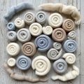Rolls of wool roving arranged on a distressed wooden surface Royalty Free Stock Photo