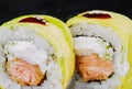 Rolls wrapped in avocado with fried salmon inside Royalty Free Stock Photo