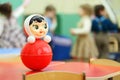 Roly-poly toy stand at table in kindergarten Royalty Free Stock Photo