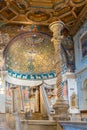 View of golden religious mosaic and other decorative elements inside Saint Clemens Basilica in Italy