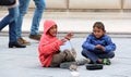 Roma boy singing and playing darbuka asking for money downtown of Skopje,capital of Macedonia Royalty Free Stock Photo