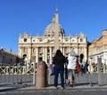 A nun looking at the Basilica at St. PeterÃ¢â¬â¢s Square with the egyptian Obelisk. Vatican City, Rome, Italy. Royalty Free Stock Photo