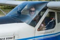 ROMA, ITALY - AUGUST 2018: Female instructor and little girl child at the helm of a light aircraft Tecnam P92 Echo