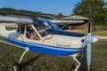 ROMA, ITALY - AUGUST 2018: Female instructor and little girl child at the helm of a light aircraft Tecnam P92 Echo