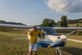 ROMA, ITALY - AUGUST 2018: Young pilot near his light aircraft Tecnam P92-S Echo