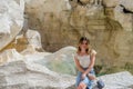 ROMA, ITALY - AUGUST 2018: Young pretty girl near Fountain de Trevi in Rome, Italy