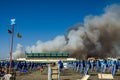 ROMA, ITALY - JULY 2017: Fire with smoke clouds on the beach with blue umbrellas and sun loungers in Ostia, Italy Royalty Free Stock Photo