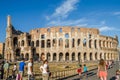 ROMA, ITALY - JULY 2017: Tourists are walking near the Arc de Triomphe of Constantine and the Colosseum in Rome, Italy Royalty Free Stock Photo