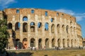 ROMA, ITALY - JULY 2017: Tourists are walking near the Arc de Triomphe of Constantine and the Colosseum in Rome, Italy Royalty Free Stock Photo