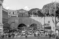 Roma, Italy - October 2015: A large crowd of pedestrians tourists passes through a pedestrian crossing a busy street with traffic