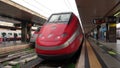 Roma, Italy. Termini train station. Train stopped at the platform waiting for passengers. High speed train Freccia Rossa