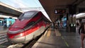 Roma, Italy. Termini train station. Train stopped at the platform waiting for passengers. High speed train Freccia Rossa 1000