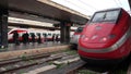 Roma, Italy. Termini train station. Train stopped at the platform waiting for passengers. High speed train Freccia Rossa