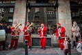 Roma music band dressed as santa claus playing for serbian christmas in the streets of belgrade.