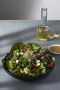 Romaine lettuce salad with strawberries, cheese, cucumber and herbs girls view from above on gray worn table. Royalty Free Stock Photo