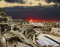 Roman amphitheatre in the city of El JEM in Tunisia amid colorfull sunset Royalty Free Stock Photo