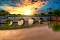 Roman ancient tiberius and augusto bridge over marecchia river in Rimini Italy at sunset or sunsrise Royalty Free Stock Photo