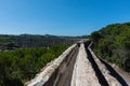 Roman aqueduct of Pegoes surrounded by greenery under sunlight in Tomar in Portugal Royalty Free Stock Photo