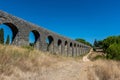 Roman aqueduct of Pegoes surrounded by greenery under sunlight in Tomar in Portugal Royalty Free Stock Photo