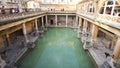 Roman Bath, UK - December 6, 2013: Tourists visiting inside Roman Baths complex. City of Bath is a UNESCO World Heritage Site. Se Royalty Free Stock Photo