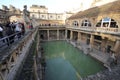 Roman Bath, UK - December 6, 2013: Tourists visiting inside Roman Baths complex. City of Bath is a UNESCO World Heritage Site. Se Royalty Free Stock Photo