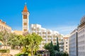 Roman baths ancient ruins site, modern buidings and Saint Louis Cathedral of the Capuchin Fathers Latin Catholic church in the