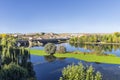 The Roman bridge over the Tormes river and its folliage in the ducal village of Alba de Tormes, Spain. Village were house the