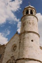 Roman catholic church our lady of the rocks on island islet in boka kotor bay near perast town in front of mountains range and blu Royalty Free Stock Photo