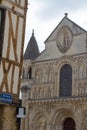 Roman church of Poitiers, France and half-timbered street house Royalty Free Stock Photo