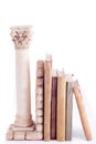 Roman column bookend and old books Royalty Free Stock Photo