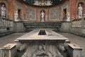 Roman Empire times UNESCO world heritage site forum amphitheater yard with stone table chairs and marble sculptures ancient