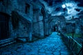 Roman Forum at night, Rome, Italy. Mystery creepy view of Ancient street in full moon Royalty Free Stock Photo