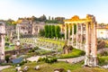 Roman Forum with ruins of Temple of Saturn on sunny summer morning. Antique ruins in Rome, Italy