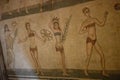 Roman girls in bikinis on mosaic floor