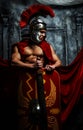 Roman good shaped warrior holds sword and schield