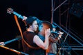 Roman Iagupov, singer of Moldovian folk rock group Zdob si Zdub, plays guitar at live concert in Nemyriv, Ukraine, editorial photo Royalty Free Stock Photo