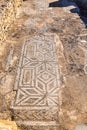 Roman mosaic floor with geometric patterns at the Uthina Archaeological Site