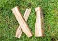 Roman numeral. Roman numerals made from oak. Old wood numbers. Old roman antique alphabet number on green grass background. Number Royalty Free Stock Photo