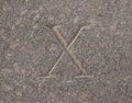 Roman numeral - ten carved in stone