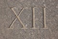 Roman numeral - twelve carved in stone