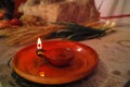 Replica of ancient Roman oil lamp with lighted candle on thanksgiving table Royalty Free Stock Photo