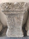 Roman pillar with latin inscriptions and decorations