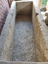 Roman sarcophagus inside rough stonework