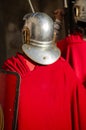 A Roman soldier with a shield, seen from behind at a historical reenactment Royalty Free Stock Photo
